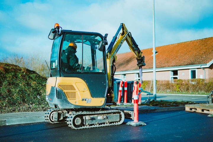 Compact mini excavator operating on a job site